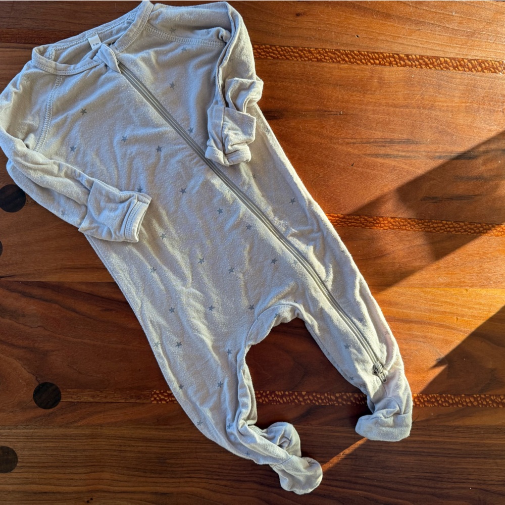 Quincy Mae star onsie in stretchy fabric.